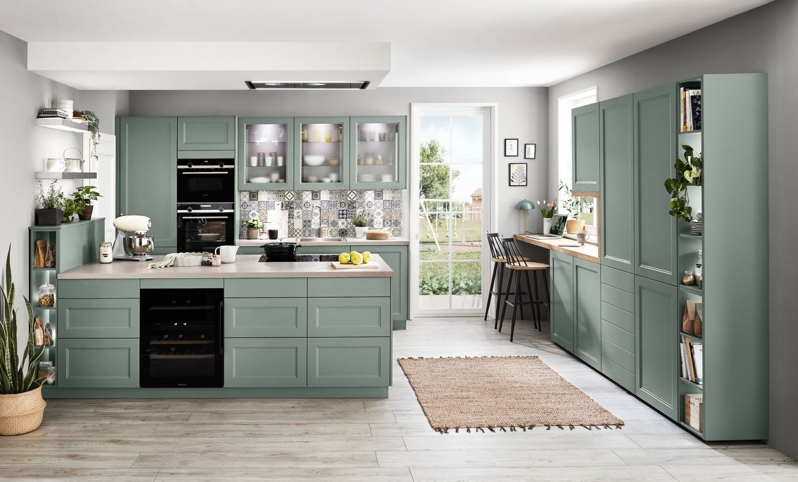 Sage green framed-front nobilia kitchen