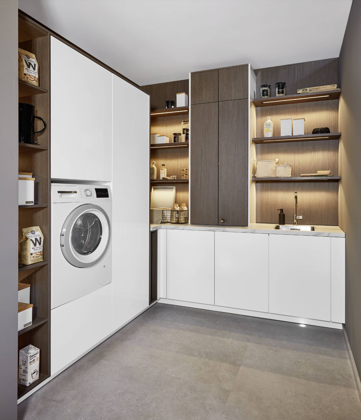 Laundry room with built-in washer and storage